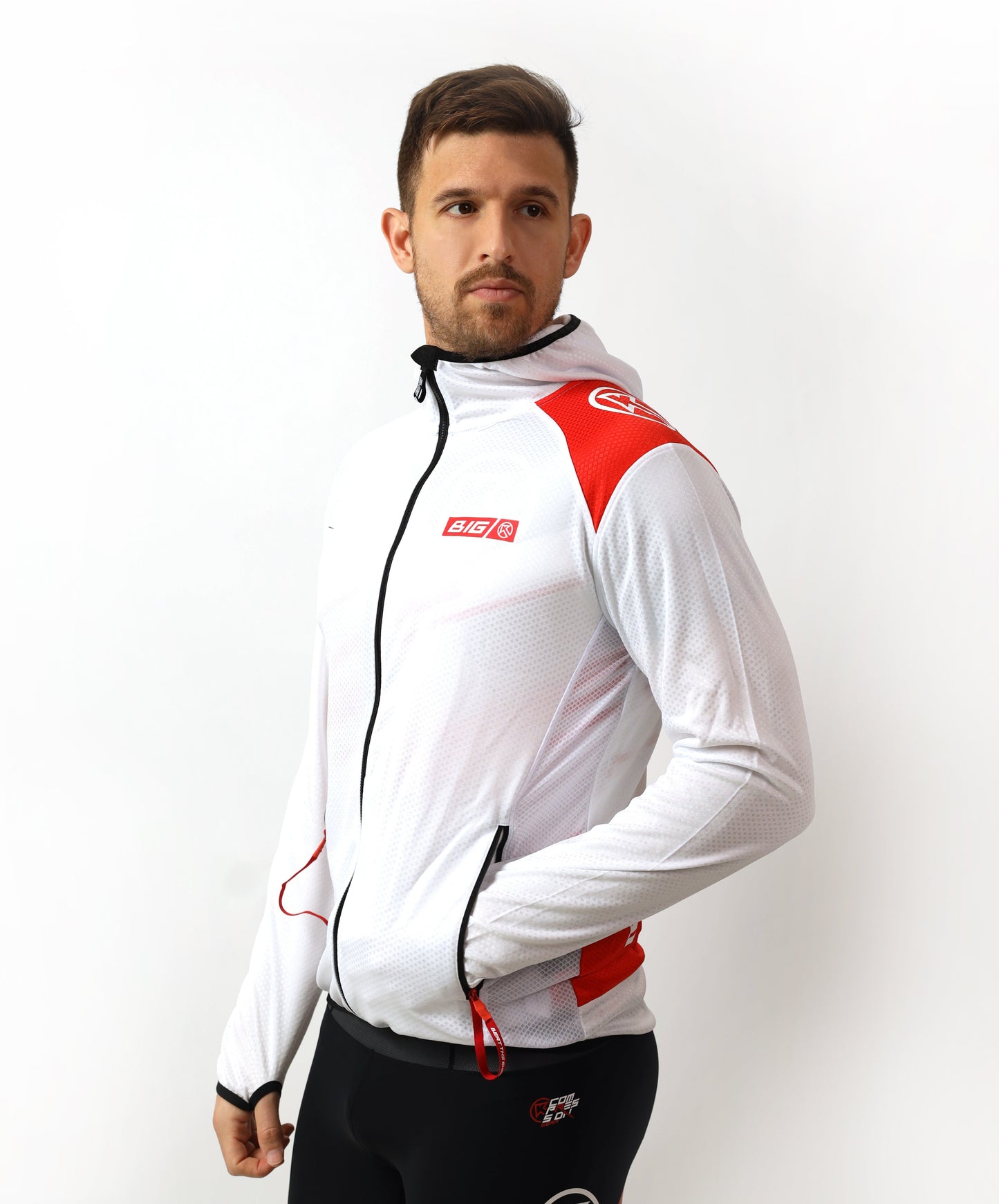 Man wearing a white and red jacket with black pants on a white background