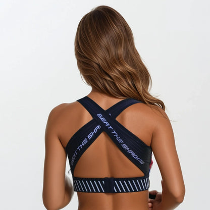 Person wearing a sports bra with 'Beat the Ship' branding on a plain background