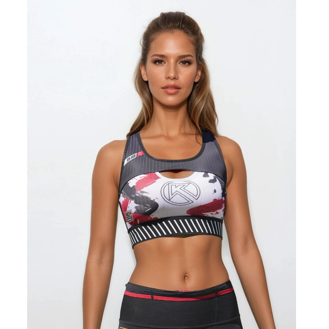 Woman wearing a sports bra with a brand logo on a white background