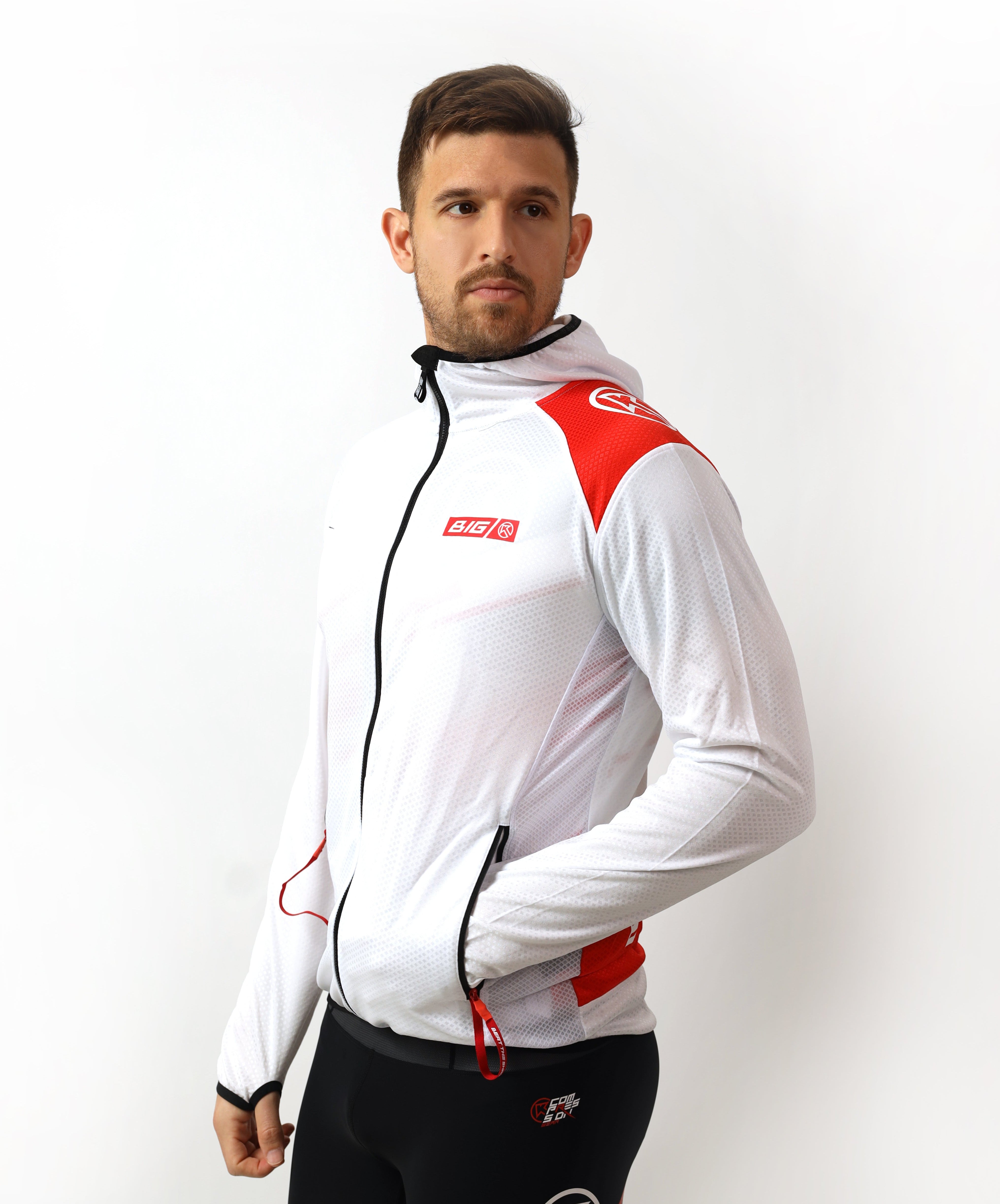 Man wearing a white and red jacket with black pants on a white background